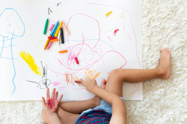 istock Little girl drawing 1172970938