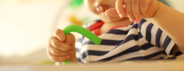 istock Kid's hands with toy 1172971241