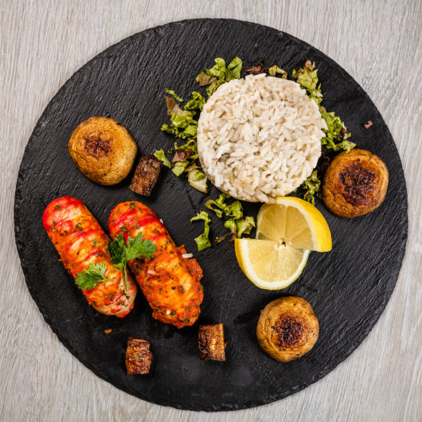 istock Lobster Tails served on granite plate 1172974265
