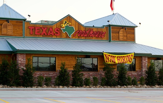 Houston, Texas/USA 09/06/2019: Texas Roadhouse restaurant being prepped for opening in Humble, TX with a hiring sign out front. Founded in 1993 it's known for some of the greatest steak in town and free peanuts in buckets.