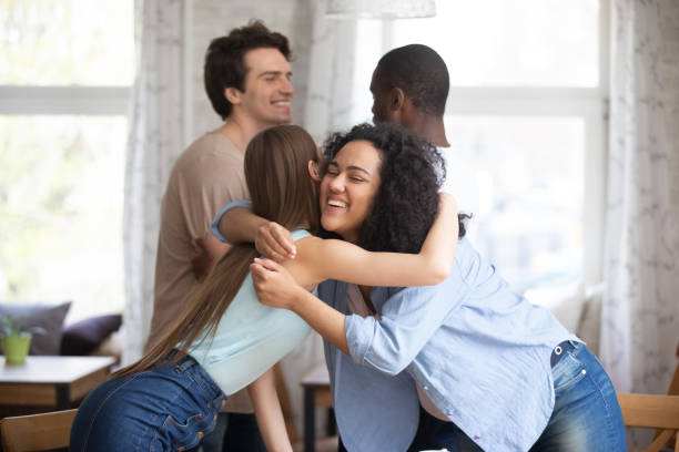 istock Happy mixed race young couples greeting each other. 1172977635