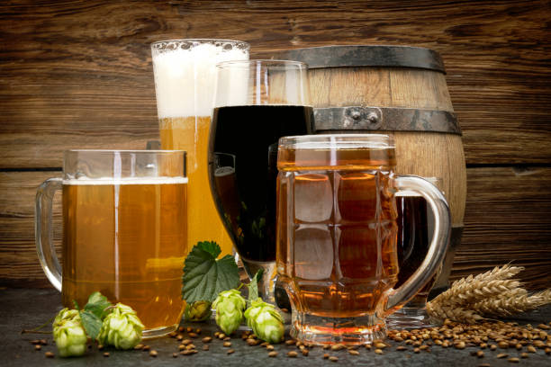istock Glasses of beer with green hops and wheat 1172977749