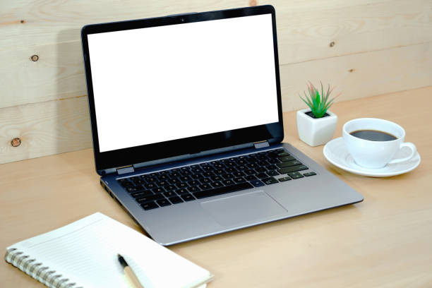 istock Coffee cup and laptop in office table 1172977753