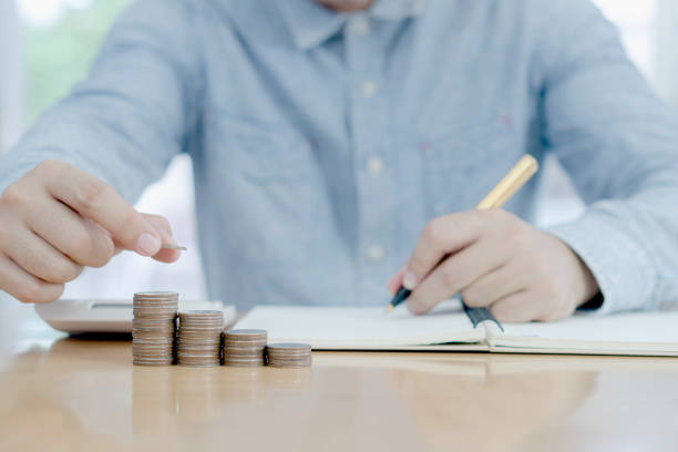 istock Business accounting with saving money with hand putting coins on stack concept financial 1172977808