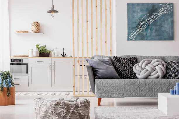 istock Abstract blue painting on empty white wall of open plan apartment 1172982188