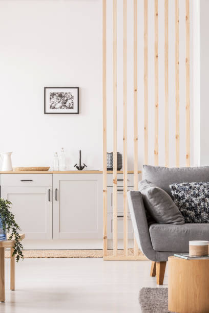 istock Small studio apartment with contemporary kitchen and grey settee, real photo 1172982191