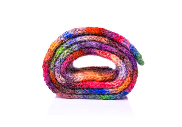 istock Winter multi-colored woolen scarf on white background. 1172982634