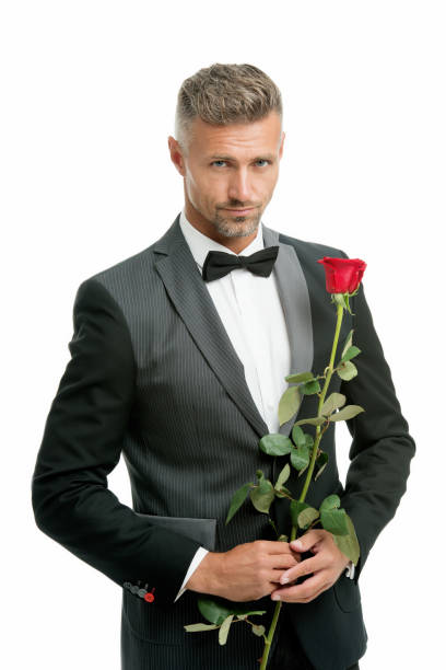 istock Make good first impression. Valentines day and anniversary. Romantic gentleman. Man mature confident macho with romantic gift. Handsome guy rose flower romantic date. Well groomed macho tailored suit 1172983626