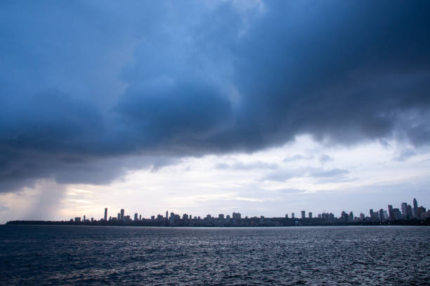Monsoon clouds and heavy rainfall over Arabian sea in Mumbai city. Monsoon clouds and heavy rainfall over Arabian sea in Mumbai city , Extreme clouds over Arabian sea in Mumbai. An extremely rare scenario or cloud porn over the Mumbai city in India arabian sea photos stock pictures, royalty-free photos & images