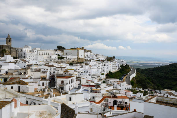 View of the white houses of Vejer de la Frontera in Andalusia, Spain The photo was taken on a summer day with blue sky and white clouds. There is copy space for text. mijas pueblo stock pictures, royalty-free photos & images