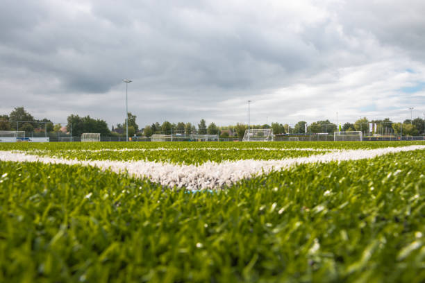 Artificial grass on a football playing ground