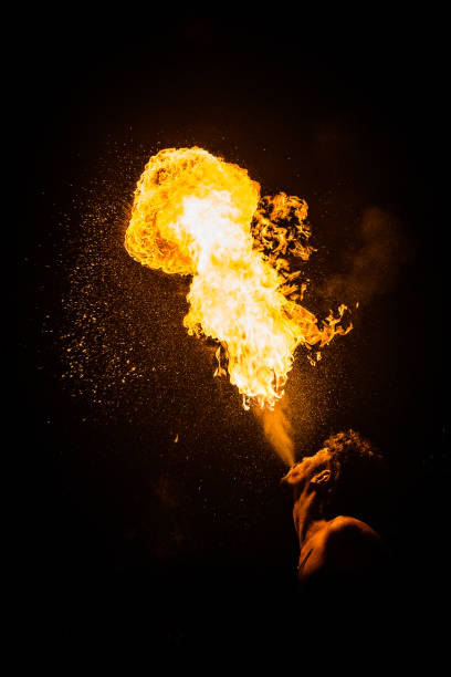 istock profile image of a fire eater spitting flames into the sky 1172994041