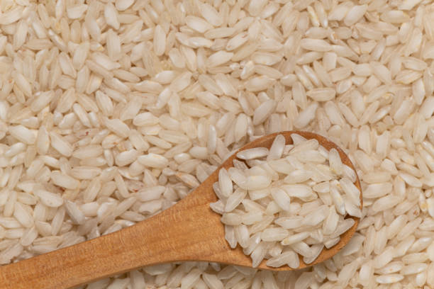 istock Raw Short Grains Italian Rice Background Texture 1172994091