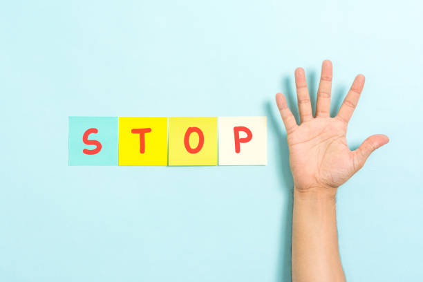 istock Stop gesture sign concept with hand palm raised on blue background 1172995840