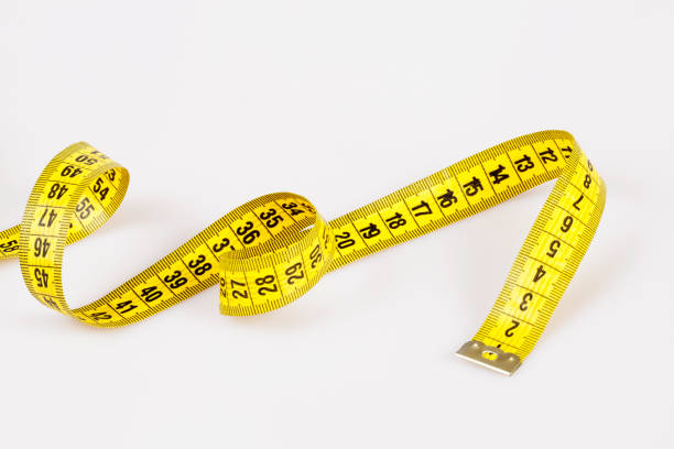 istock Slim concept with scale and measuring tape on white background top view 1172995841