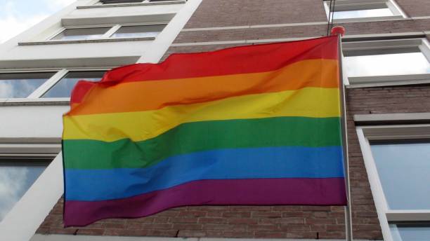 istock Rainbow Flag Hanging On Building Scenery In The Netherlands. Europe 1172996228