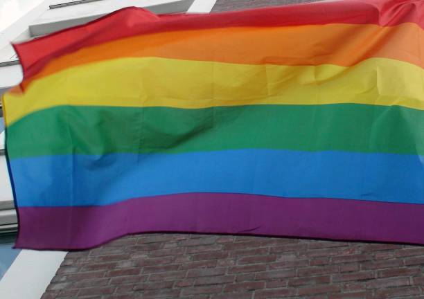 istock Rainbow Flag Hanging On Building Scene In The Netherlands. Europe 1172996235