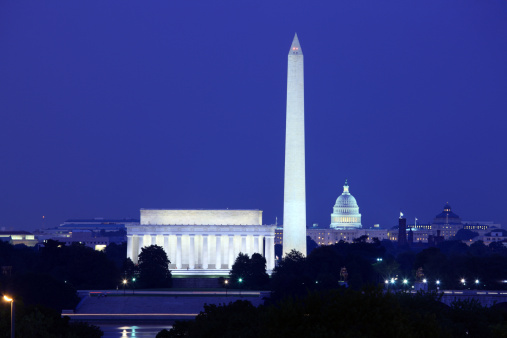 Night shot of the Washington DC skyline, the Washington Monument (L) and the U.S. Capitol (R).