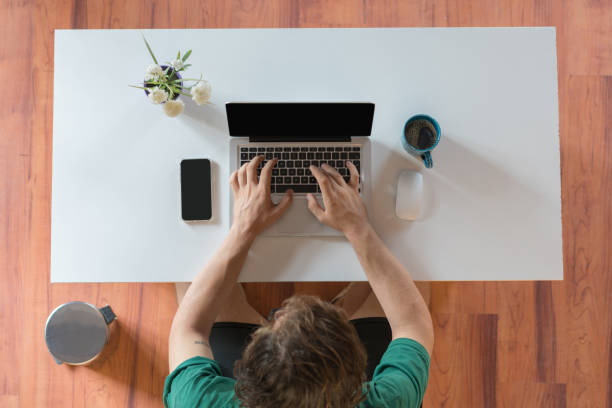istock Casual young businessman sitting at desk 1173001340