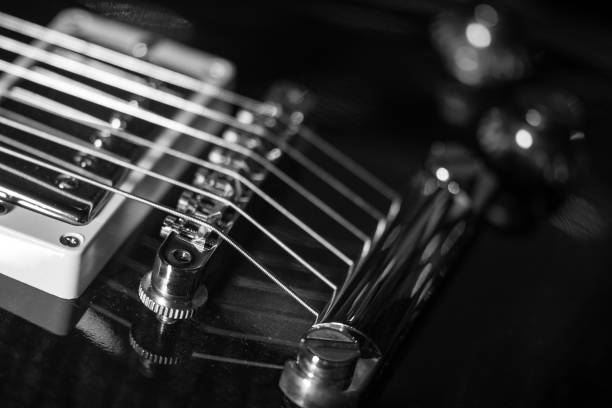 istock electric guitar, black & white, close-up 1173002395