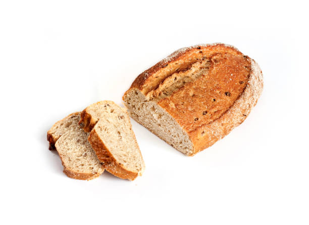 istock Loaf of whole wheat bread with slices isolated on white background 1173002656