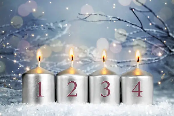 Four Christmas Advent candles burning