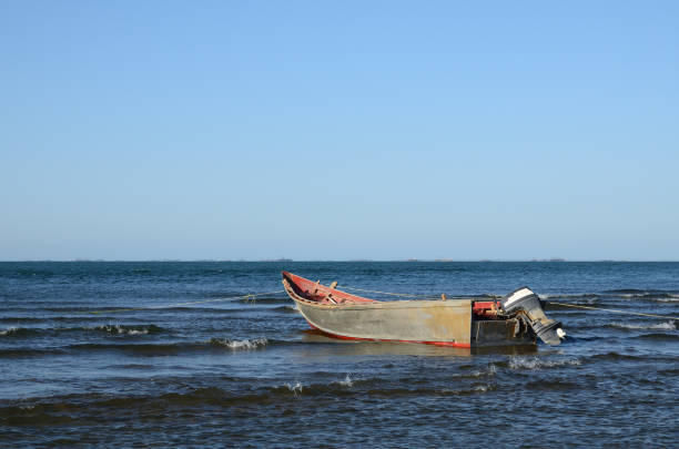 istock Old wooden boat by the sea 1173005454