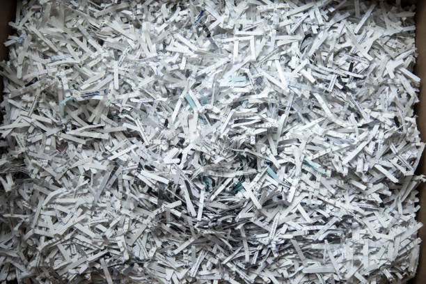 Close up of shredded paper Close up of shredded paper shredded stock pictures, royalty-free photos & images