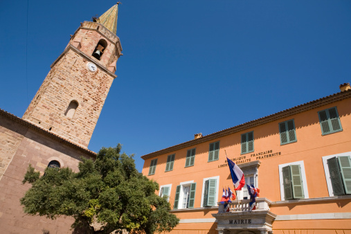 town hall of Fréjus with the clock tower of the cathedral on the left; Fréjus, France