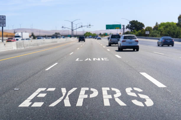 istock Express Lane marking on the freeway; San Francisco Bay Area, California; Express lanes help manage lane capacity by allowing single occupancy vehicles to use them for a fee 1173009823