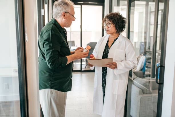 istock Senior men attended by a doctor 1173024068
