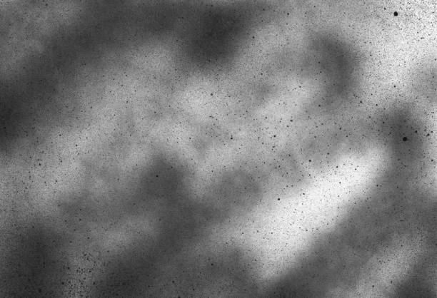 istock Subtle grain texture. Abstract black and white gritty grunge background. Dark paint spray particles on paper 1173024805