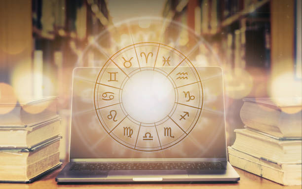 istock Zodiac sign horoscope astrology and constellation study for foretell and fortune telling education course concept with horoscopic wheel over old book and computer laptop in school library 1173024807