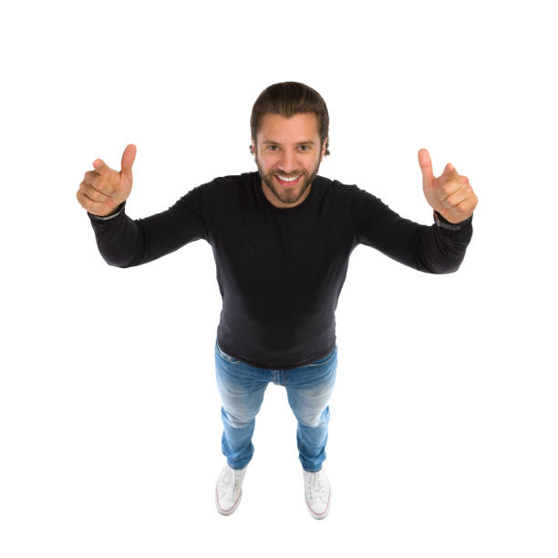 istock High Angle View Of Smiling Man In Black Jersey Standing And Pointing At Camera. 1173024821