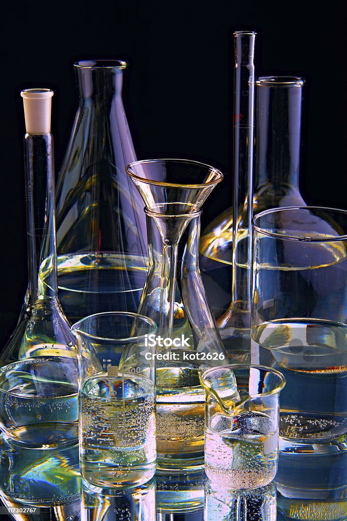chemical flasks chemical flasks on black background Accuracy Stock Photo