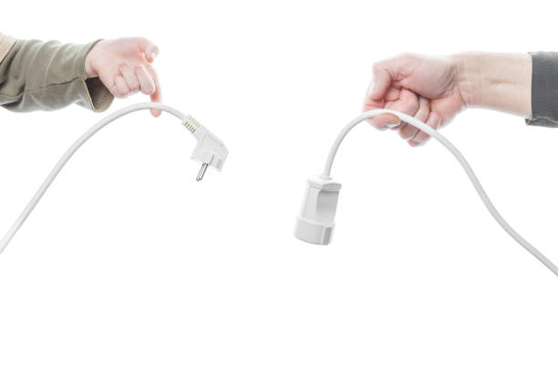 istock electric plug in hands isolated on a white background 1173033416
