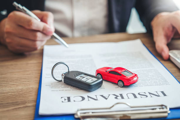 Sale agent  deal to agreement successful car loan contract with customer and sign agreement contract  Insurance car concept. stock photo