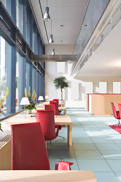 istock Sunny office lobby with plastic maroon chairs 117304759