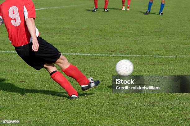 Football Player Takes A Free Kick Stock Photo - Download Image Now - Athlete, Club Soccer, Color Image