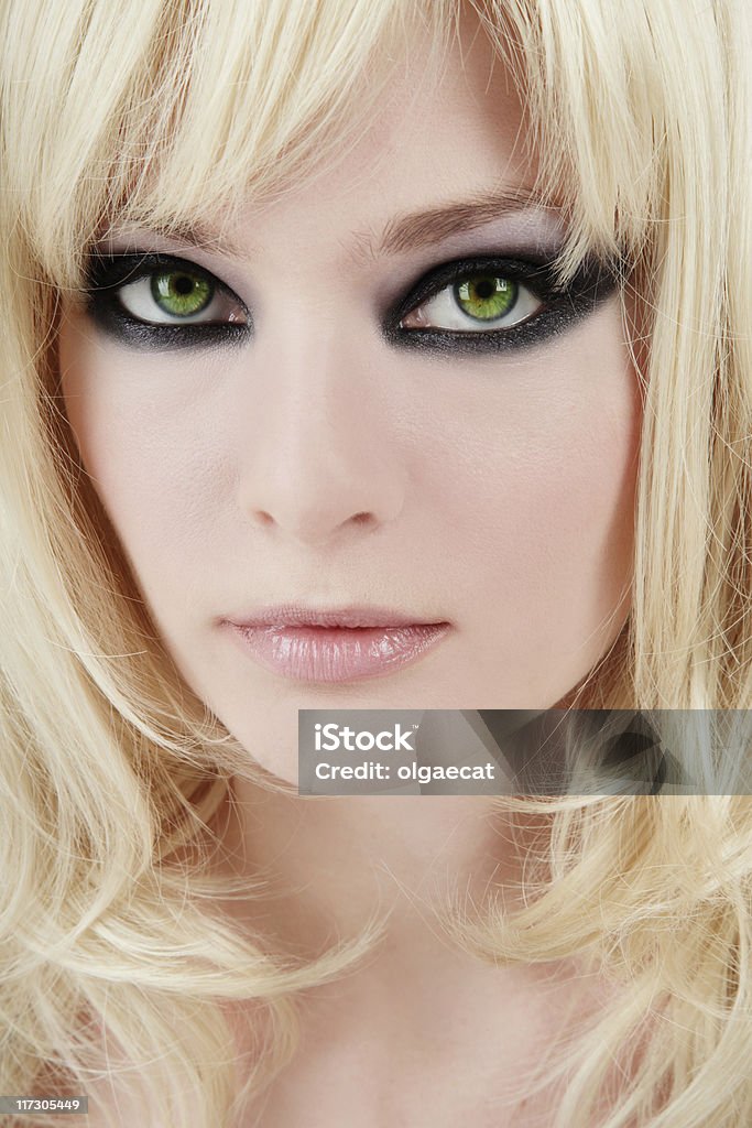 Green-eyed blonde Close-up portrait of young green-eyed blonde with trendy makeup Fashion Model Stock Photo