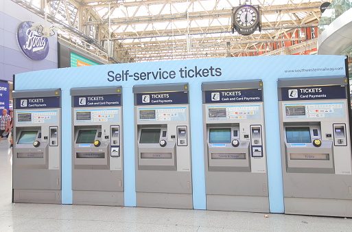 London England - June 2, 2019: Waterloo train station self service ticket machine railway London UK