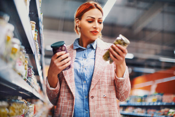 istock Buying olives at supermarket. 1173075799