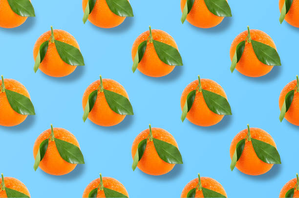 istock Whole orange fruits pattern on colorful background 1173075861