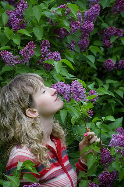 istock The girl smells a lilac 117307736