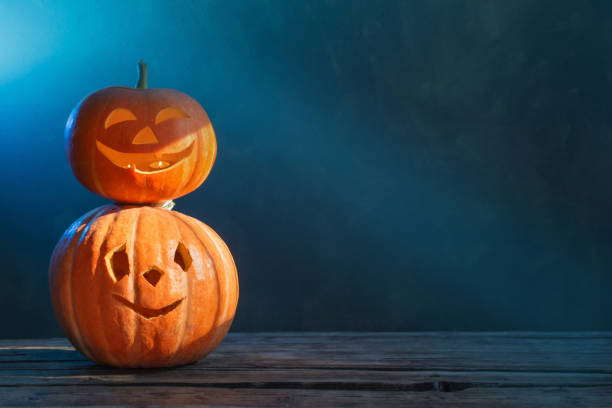 istock Halloween pumpkin on dark background 1173082260