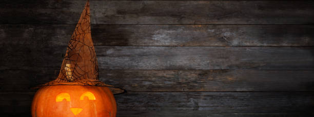 istock Halloween pumpkin on old wooden background 1173082276