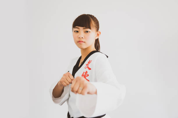 istock Young asian Taekwondo Instructor getting dressed and exercising 1173084093