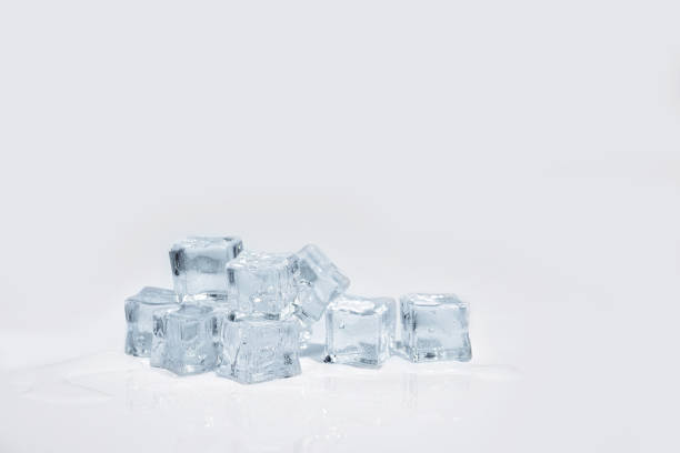 ice cubes on white background - ice blocks imagens e fotografias de stock