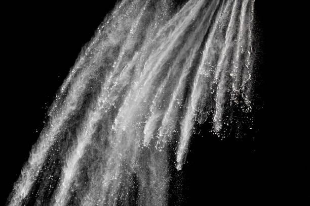 istock Bizarre forms of white powder explosion cloud against black background.White dust particles splash. 1173089594