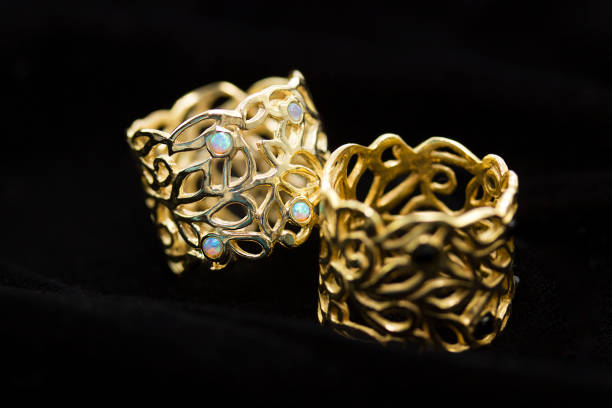 istock gold ring with a diamond on a black background, close-up. 1173090573